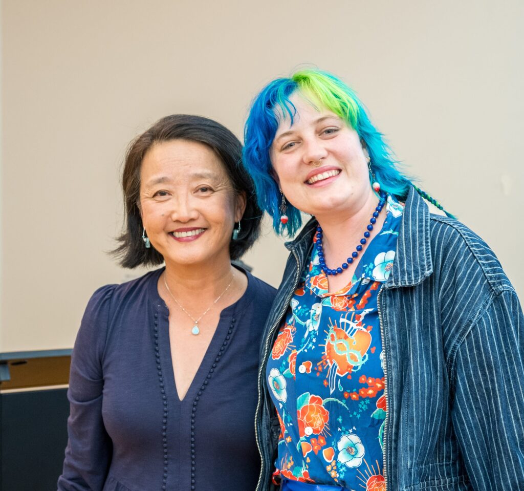 Bora Lee Reed with a reader at a book event